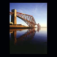 iron metal train transport travel history historic historical construction industry industrial blue sea sky skies estuary water
 engineering crossing spanning span over structure stone  Scottish photographs Doug Houghton