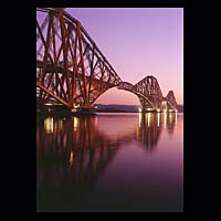 iron metal train transport travel history historic historical construction industry industrial dark blue purple night sky skies water
 engineering crossing spanning span over structure steel  Scottish photographs Doug Houghton