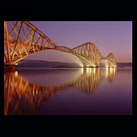 iron metal train transport travel history historic historical construction industry industrial dark blue purple night sky skies water
 engineering crossing spanning span over structure  Scottish photographs Doug Houghton