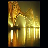 iron metal train transport travel history historic historical construction industry industrial yellow orange night sky skies water
 engineering crossing spanning span over structure  Scottish photographs Doug Houghton